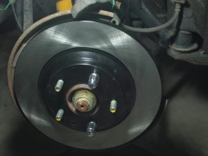 Place the new Brake Rotor.  Use lug nuts to hold it in place.
