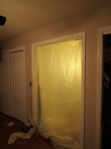 The first and most important thing before demolition.  put a vinyl sheet up to keep the dust from getting all over the house.  (well, wasn't that successful, but hey, better than nothing!)