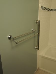 I installed the double towel bar, and grab bar outside the tiles